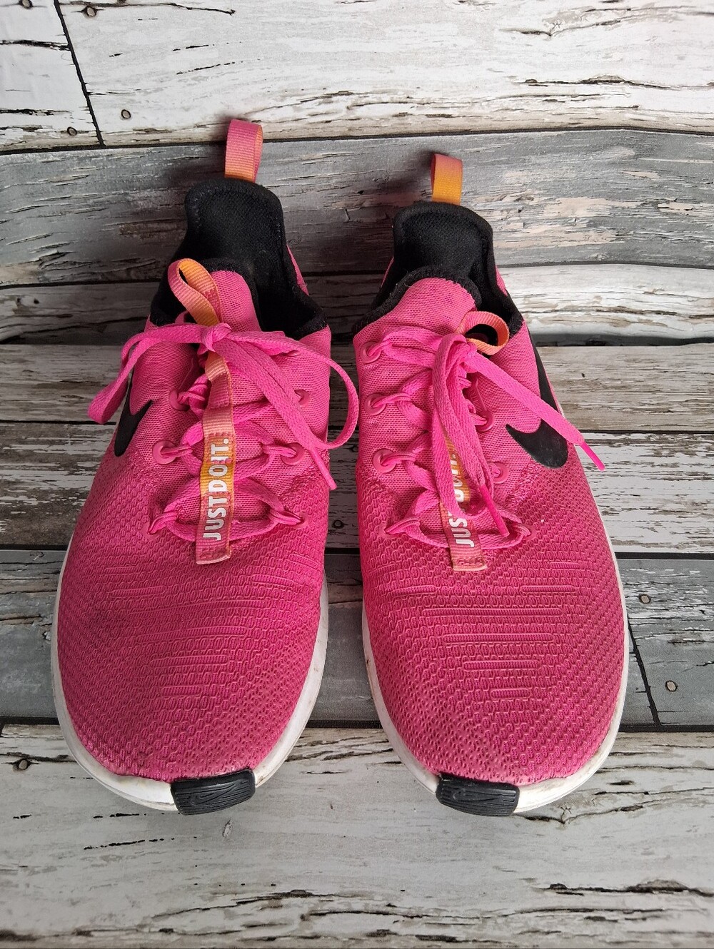 Nike Pink Athletic Running Shoes with Black Swoosh